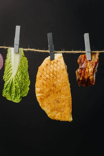 Doner kebab with ingredients hanging on a thread in the air. High quality photo