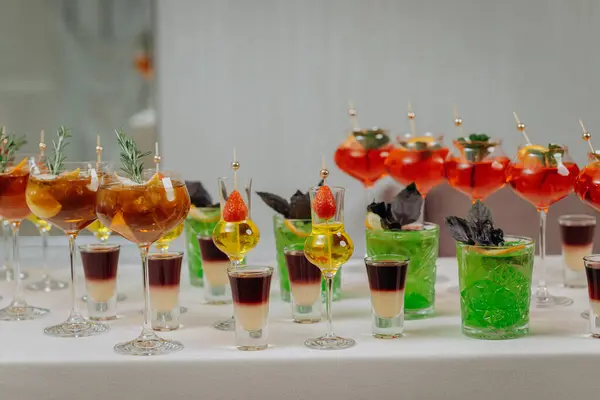 Welcome drink with cocktail glasses and drinks at an event. Alcoholic beverages at a wedding table