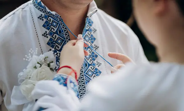 Stock image Ukrainian wedding tradition with embroidered shirts, symbolizing cultural heritage and love. High quality photo