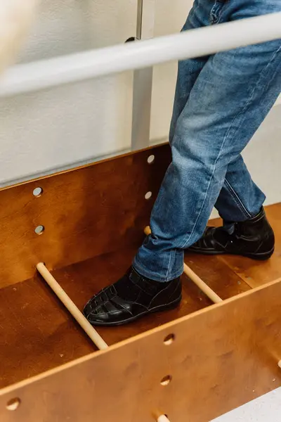 stock image Close-up of patients feet during a physical therapy session, focusing on walking exercise equipment. High quality photo