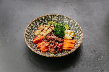 Protein-packed quinoa bowl with steak, veggies, and eggs for a balanced, nutritious meal. High quality photo clipart