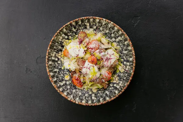 stock image Pasta with mushrooms, cherry tomatoes, and creamy sauce topped with microgreens and Parmesan cheese. High quality photo