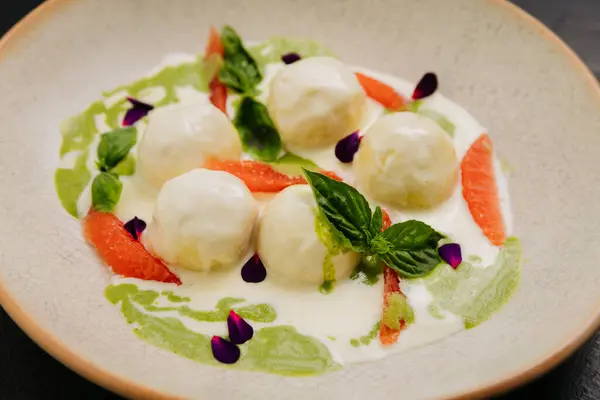 stock image Gourmet cheese balls with herbs and citrus on an plate, perfect for culinary and food photography. High quality photo