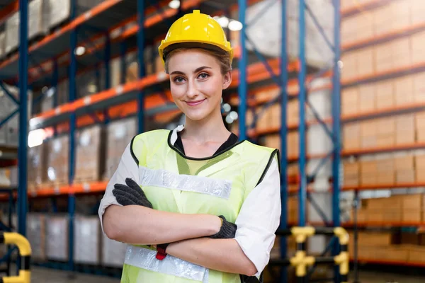 smart woman worker wearing working suite dress and safety helmet at cargo for stack item for shipping.female worker checking the store factory. industry factory warehouse. Inspection quality control.