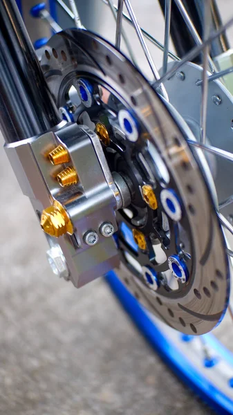 Stock image close-up view of motorcycle disk brake. Front-wheel Motorcycle disk brake system