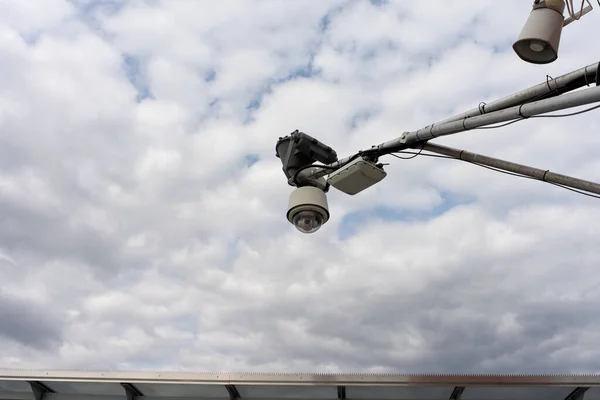 CCTV Camera hanging on the roof. Security cctv camera or surveillance system. Security camera equipment and traffic concept - Security camera equipment on pole.
