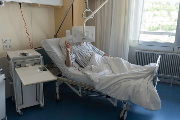 There is a sick male patient in the hospital after surgery. Outpatient treatment in Germany.