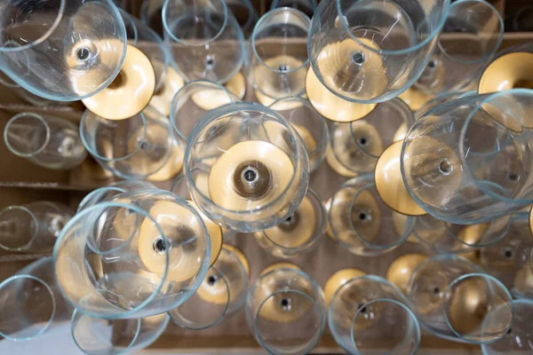 Top view of the pyramid of wine glasses.  A lot of empty wine glasses.