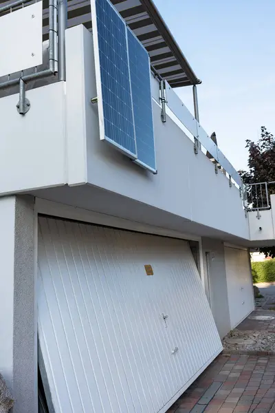 Solar battery on balcony wall in Germany. Balcony power plant. Small Solar Panel energy system.