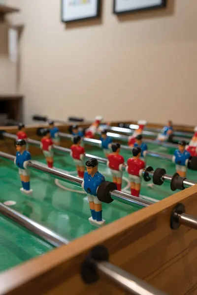A children's room with a tabletop football game. A game room with tabletop games. Football.