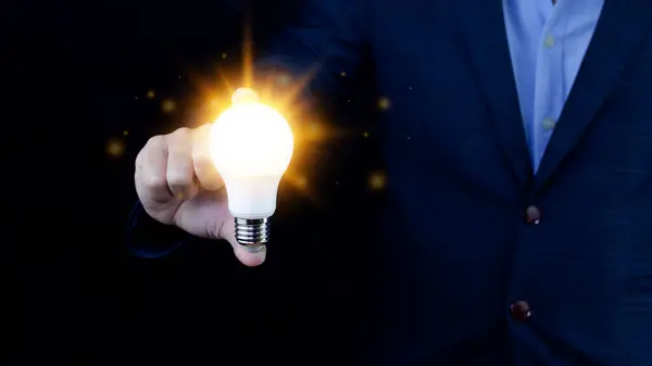 Bright idea in hand Business man,Hands holding light bulb for concept new idea concept with innovation and inspiration,technology in science and communication concept