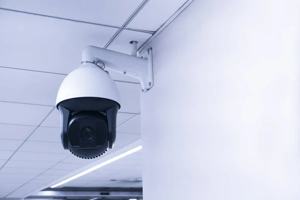 Security CCTV camera or surveillance system in building ,Closed-circuit television,Modern CCTV camera on a wall.