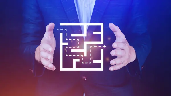 Businessman drawing a labyrinth with digital maze icon hologram. Concept of challenging task, labyrinth entrance make a decision concept