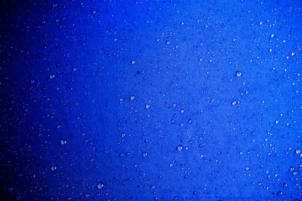 Wassertropfen Auf Dem Blauen Stoff Wassertropfen Auf Blauem Hintergrund — Stockfoto