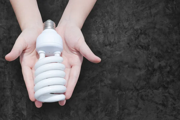 Energy Saving Concept Woman Hand Holding Light Bulb Dark Background — Stock Photo, Image