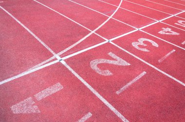 Numbers starting point on red running track,running track and green grass,Direct athletics Running track at Sport Stadium clipart