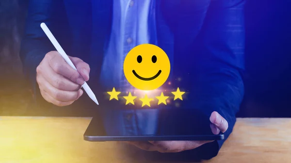 Customer services best excellent business rating experience, Positive Review and Feedback, Satisfaction survey concept. Hand of a businessman show happy smile face with five star.