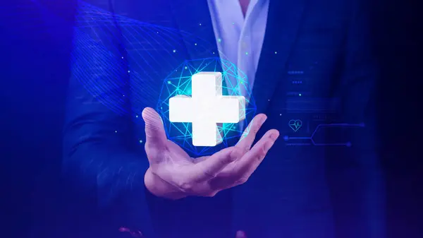 Businessman holding plus icon for health care medical, icon virtual medical health care with medical network connection, People health care awareness rising growth of medical health and life insurance business.
