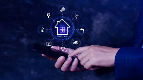 Smart home technology, User touches virtual screen on smartphone manage smart home features including security, lighting, temperature, Smart home and Iot concept.