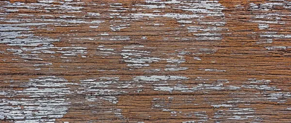 Eski grunge koyu renkli ahşap kaplama derin bir arka plan. Zengin kahverengi tonlar, eski ahşap yüzeyi, belirgin tahıl desenleri, çatlaklar, çizikler, yıpranmış kusurlar..