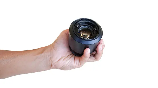 Hand Holding Camera Lens White Background — Stock Photo, Image