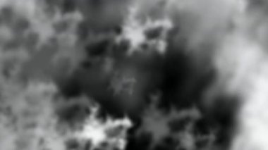 Parlayan, dağınık bir ateş kıvılcımının büyüleyici bir videosu derin bir siyah arka plana doğru kıvılcım saçıyor.