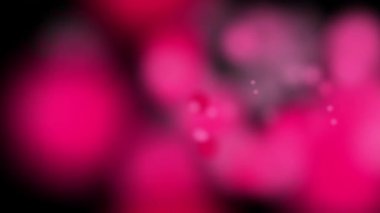 Bu video, çok sayıda yumuşak odaklı, açık mavi ve gri daireler içerir.