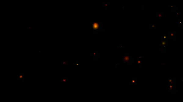 Parlayan, dağınık ateşin büyüleyici bir görüntüsü derin siyah bir arka plana kıvılcımlar saçar.