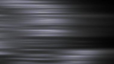 Renkli ışığın enerji akışları, koyu bir arkaplan karşısında mavi, yeşil ve mor tonlarını harmanlayarak büyüleyici bir soyut dinamik etki yaratır..