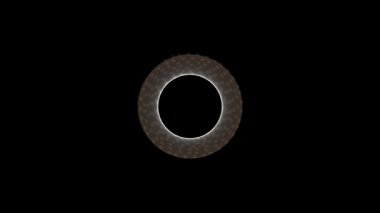 Detaylı geometrik desenlere sahip büyüleyici bir ışık halkası karanlık bir arkaplana karşı enerji ile titreşiyor, merak ve kozmik bir gizem hissi yaratıyor..