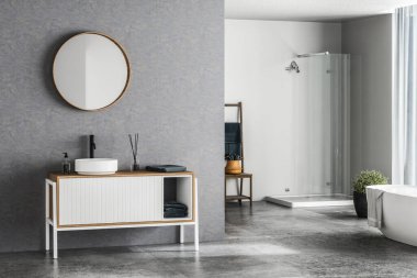 Mavi arka planlı modern banyo, beton döşeme, beyaz küvet, duş ve lavabo, yan görüş. Modern mobilyalı minimalist banyo. 3B görüntüleme