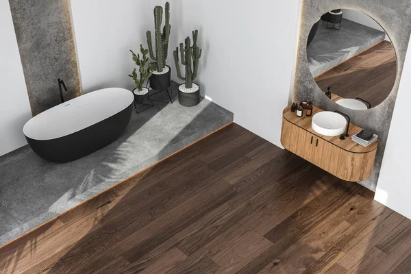 stock image Modern Loft Bathroom interior design, bathtub, parquet floor, sunlight, plants, towels, with sink on wooden cabinet, white and concrete wall background. Top view. 3d render