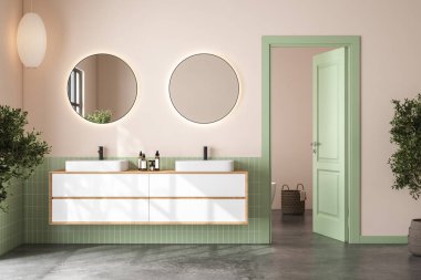 Modern banyonun içinde yeşil fayanslar, bej duvarlar, beton zemin, mermer tezgahta çift beyaz lavabo, üzerinde oval aynalar ve rahat beyaz küvet var. 3d oluşturma