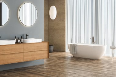 Modern banyo, mavi ve bej arka plan, parke döşeme, beyaz küvet, lavabo, bitki, yan görüş. Modern mobilyalı minimalist banyo. 3B görüntüleme