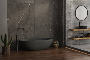 Minimum ahşap kibri, oval aynası, siyah lavabosu, mermer seramik duvarları, beton zemini, bitki ve sepetleri, banyo aksesuarları ve modern antrasit küveti olan modern bir banyo. 3d oluşturma