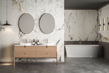 Çift lavabolu gösterişli bir banyo mermer duvarlar, beton döşemeler, kolye ve duvar lambaları, banyo aksesuarları ve beyaz bir banyo küveti. 3d oluşturma