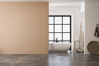 Beyaz küveti, bej ve beyaz duvarları, beton zemini ve banyo aksesuarları ve havlularıyla donatılmış bir banyo, banyo dolapları için uygun. Model için mükemmel. 3B görüntüleme