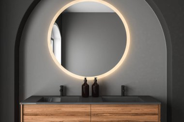 Gri duvarda ayna ve lamba olan modern banyo. 3 boyutlu. 