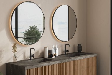 Ahşap banyo mobilyalarının üzerinde duran mermer leğen. Çift oval aynalar bej bir duvarda asılı. Yakın çekim. Ön manzara. 3d oluşturma