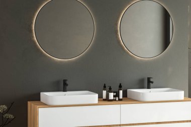 Çift lavabo, gri duvarda oval aynalar, minimalist banyoda siyah musluklar olan ahşap bir dolap. Ön manzara. 3d oluşturma