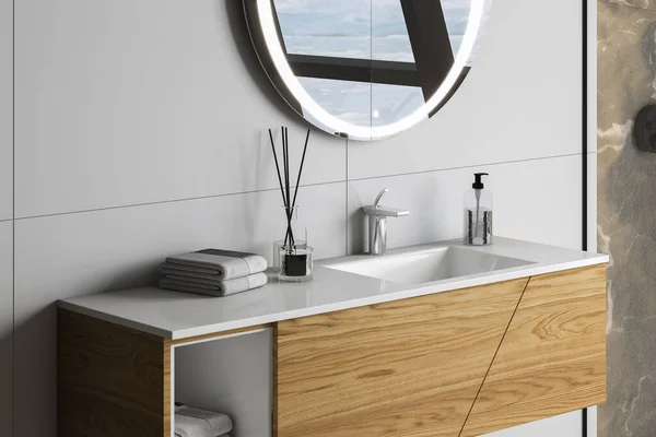 关闭白色水池与椭圆形的镜子挂在白墙上 现代橱柜与水龙头在简约的浴室 3D渲染 — 图库照片