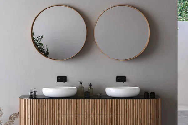 Close up of double sink with oval mirrors standing in on white wall , wooden cabinet with black faucets in minimalist bathroom. Front view. 3d rendering
