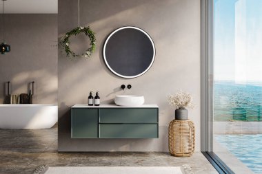 modern bathroom with beige and soil tone walls, white bathtub, green vanity, black mirror, sink, terrazzo floor, and a view of the pool and sea from the window clipart