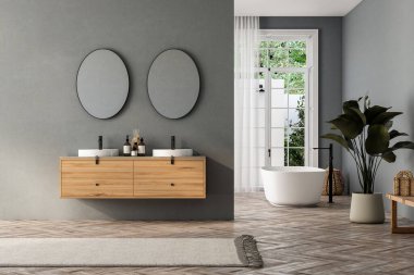 Çift lavabolu ve aynalı modern banyo, küvet, bitkiler. Otel stüdyosunda banyo aksesuarları ve pencere..