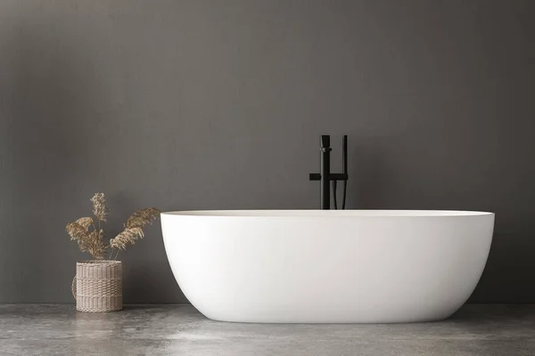 Stylish white bathtub on concrete floor with back faucet in bright bathroom, gray wall background. 3d Rendering