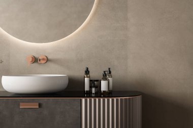Modern siyah banyo mobilyalarını beyaz lavabo ve siyah mermer tezgahlı, bej duvar arka planlı.
