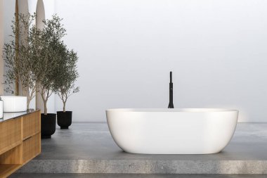 Modern minimalist banyo, modern banyo dolabı, beyaz lavabo, ahşap kibir, iç tesisler, banyo aksesuarları, küvet ve beyaz ahşap duvarlar, beton zemin..