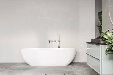 Minimalist banyo, sadelik ve modern tasarıma odaklı serbest banyo küveti ve şık eşyalar sergiliyor..