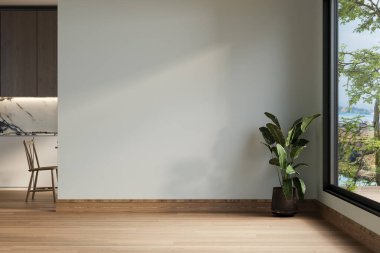 Yumuşak yeşil duvarları, ahşap döşemeleri, sadeliği ve sükuneti ön plana çıkaran minimalist boş bir alan. Saksı bitkisi doğaya bir dokunuş ekler, yaratıcı kavramlar için mükemmeldir.