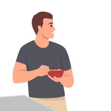 Genç adam mısır gevreği ve sütle kahvaltı yapıyor. Genç erkek masada oturuyor ve lezzetli bir yemekle yemek yiyor. Düz vektör çizimi beyaz arkaplanda izole edildi